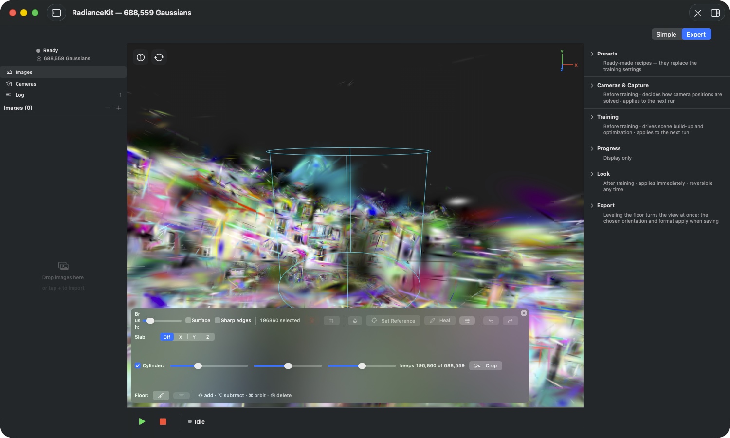 Drone scene with an active cylinder — title bar “RadianceKit — 688,559 Gaussians”, checkbox “Cylinder:” checked, a cyan cylinder wireframe with two rings stands in the scene, below it three sliders, the readout “keeps 196,860 of 688,559”, and the “Crop” button